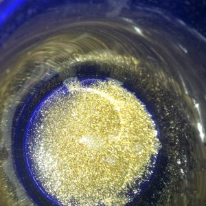Float gold recovery viewing at the bottom of a purple coffee cup. www.portadrillmini.com Gold Driller  auger sampler