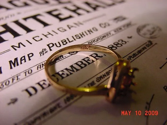 10K hallmark. The ring has a small diamond but the larger setting was missing. I am led to believe that it was an opal because I'm told that they will