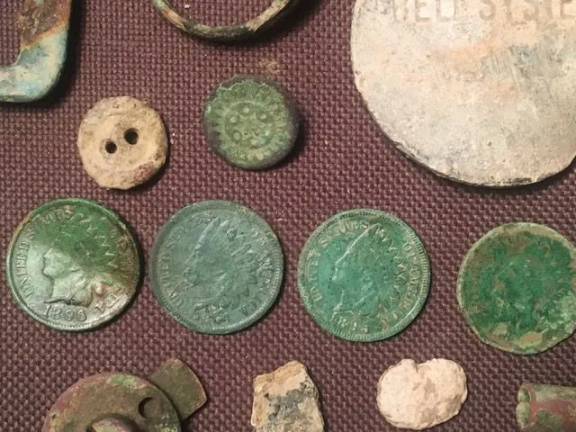 12-21. The tribe! The dates are 1864, 1881, 1895, and 1896. Also in the photo are two nice little buttons I found.