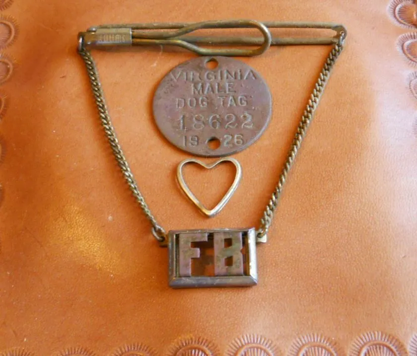 12-7-14 1926 dog Tag, a gold plated tie clasp and a gold locket rim makes for a good day.