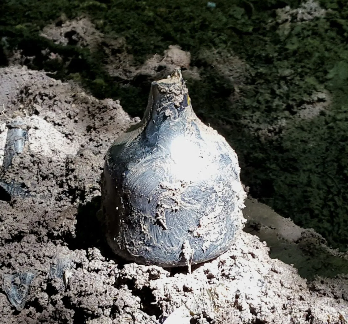 1700s black glass liquor/wine bottle-intact except for the lip