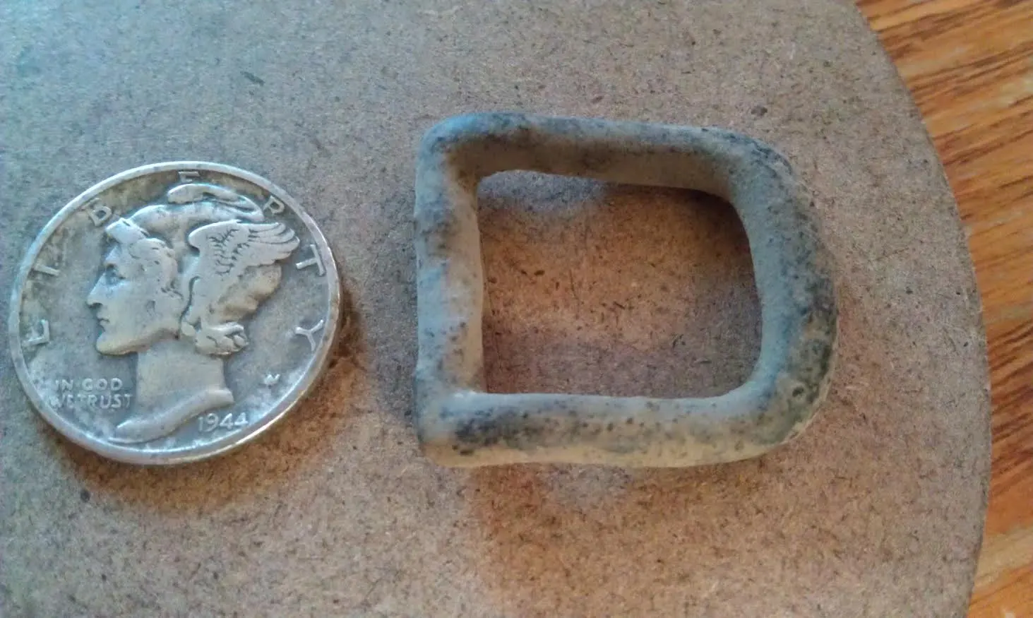 1944 Mercury Dime and a tack buckle