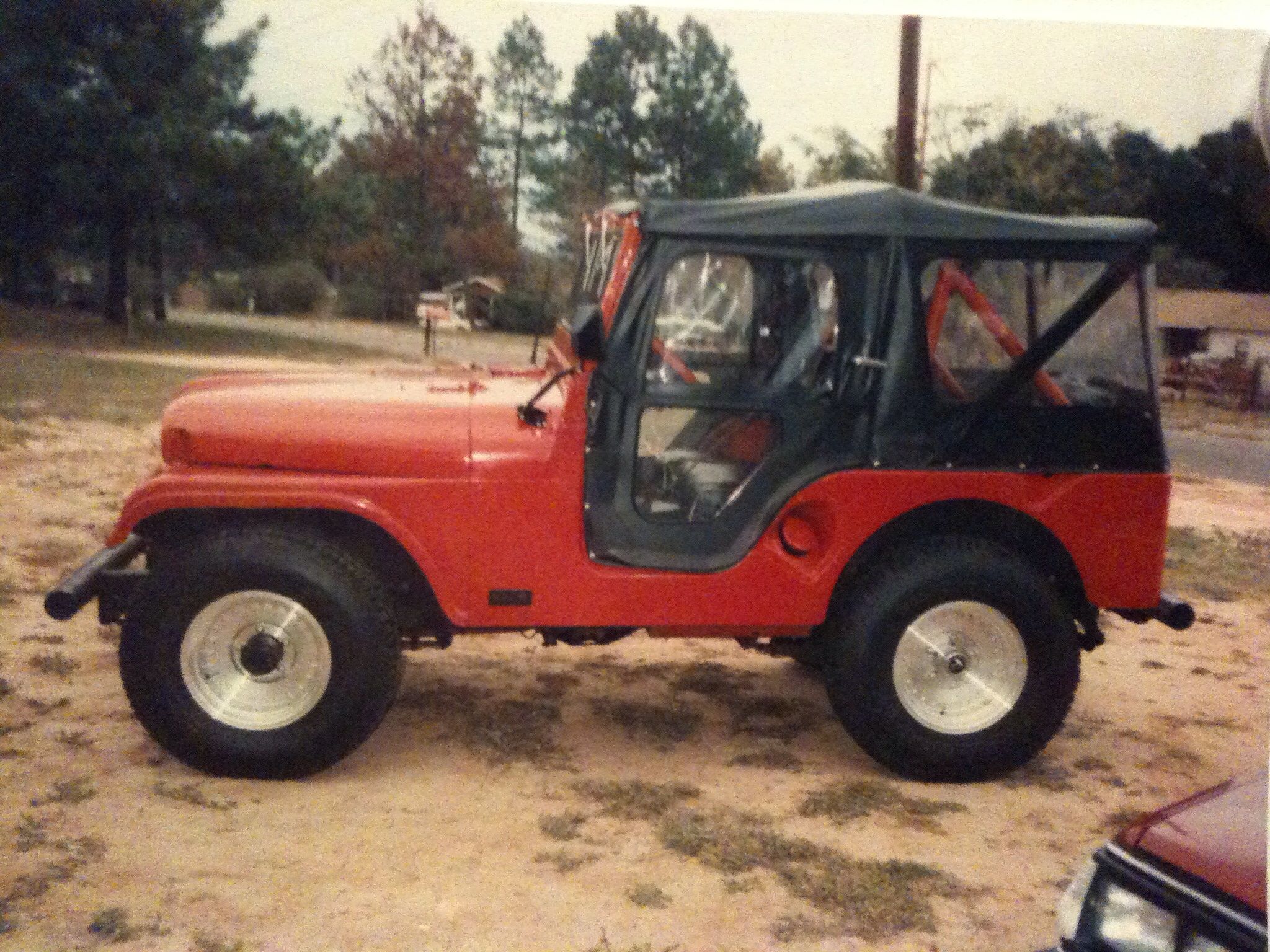 1991 - Troy, AL - My 1955 Willys Jeep after some upgrading. Added a fuse panel, electric wipers, soft top, new paint, recovered seats, carpeting, Cent