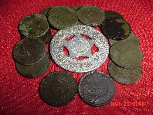 2 Indians, an aluminum good luck token, and a bunch of Wheaties found in Muskegon,  MI.