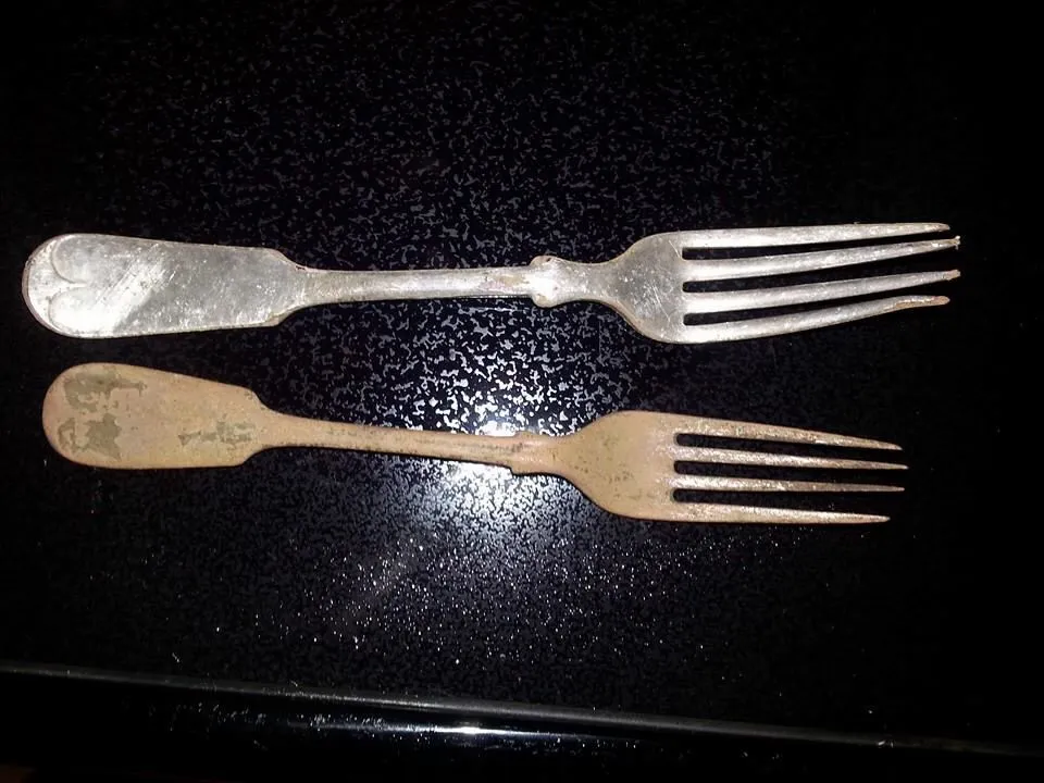 2 silver plated forks. One heavily worn