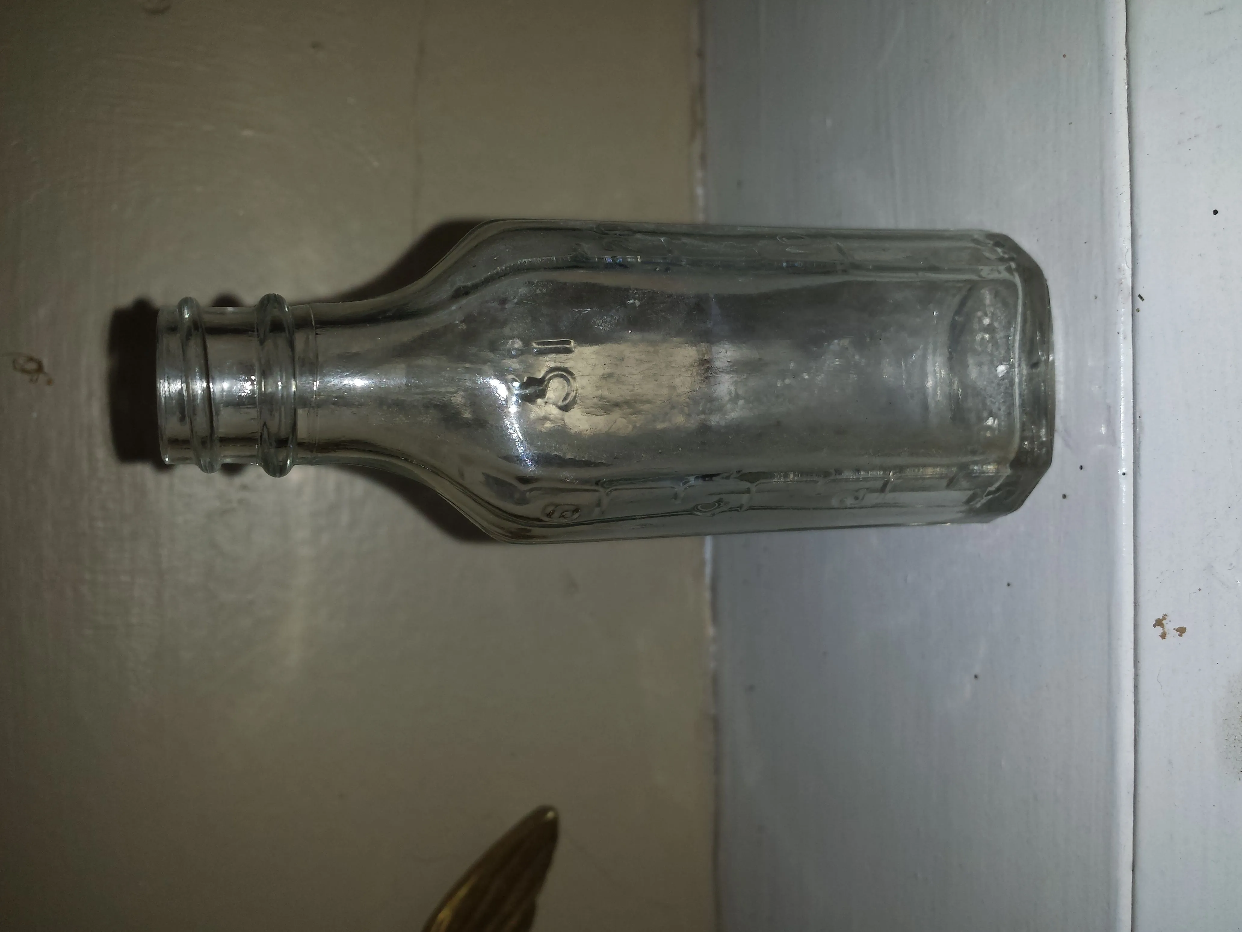 20150724 A small bottle made in 1935 by Knox Bottle Company in Jackson, MS. It was found while digging the hoe blade in another photo on private prope