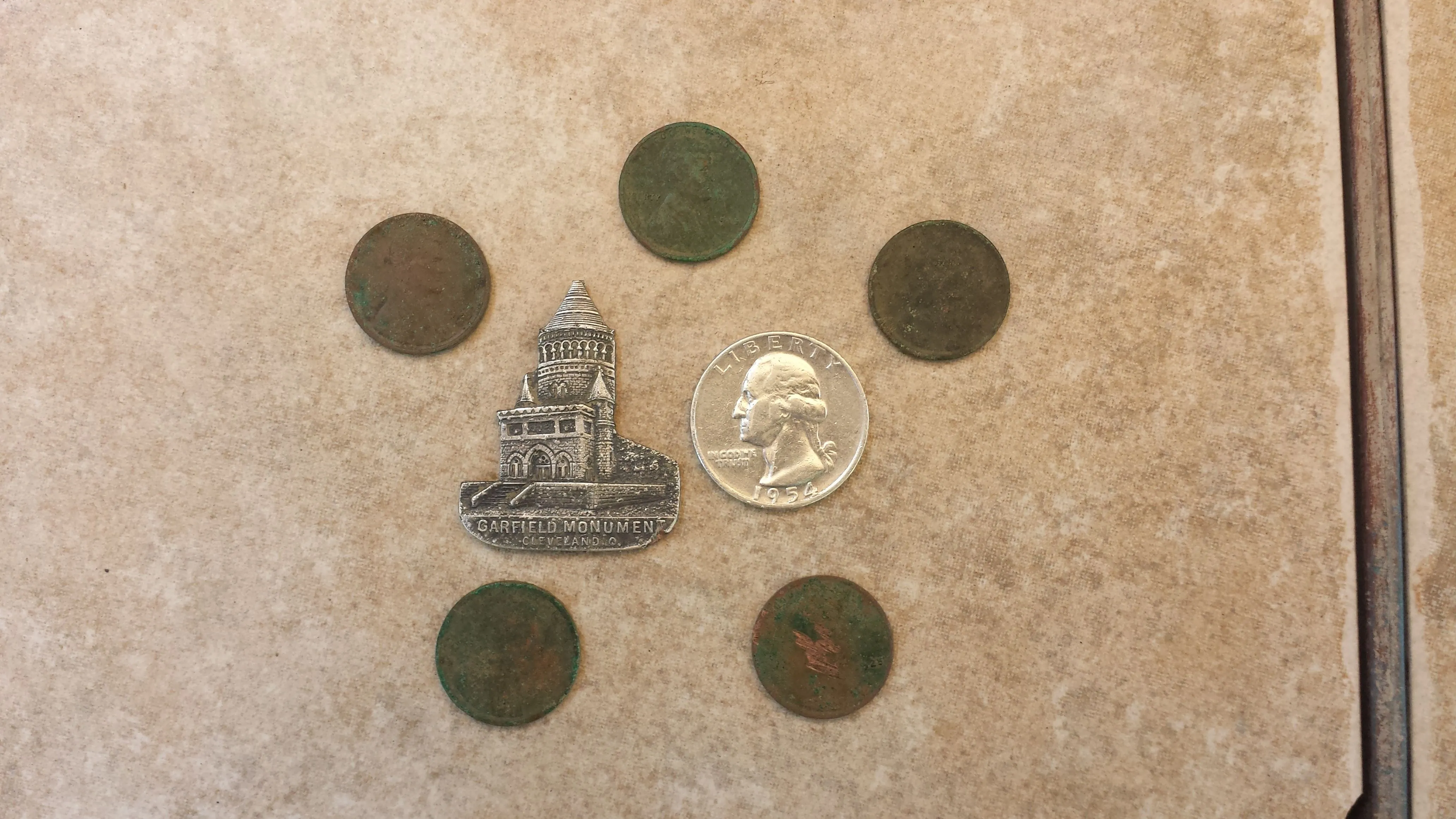 20150907 165601  Notables  1954 quarter, 5 wheats 1909, 15, 20 x 2, & 25.  Garfield Monument sovenier