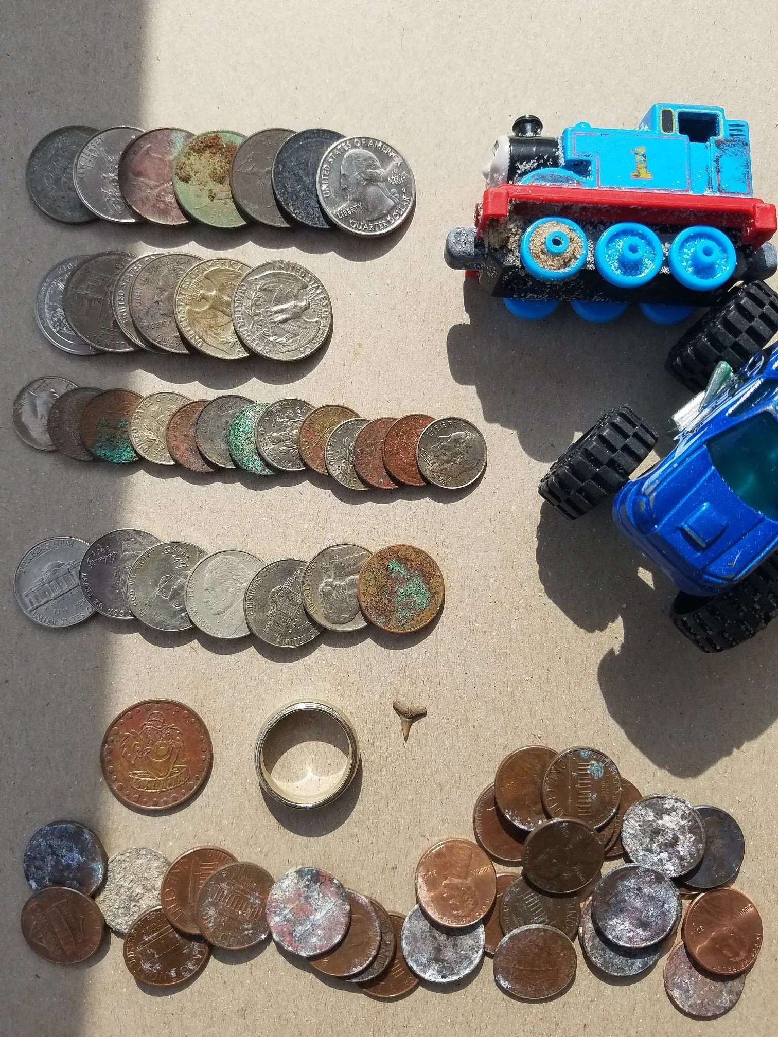 20160705 July 4th weekend totals. A little over $5 in clad, 2 cars, a token, a sharks tooth and a 9.93g white gold ring.