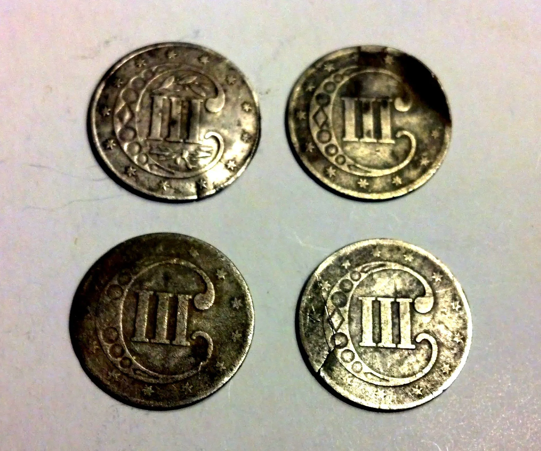 4 three cent pieces found in one field