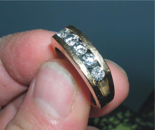 5 Diamond Gold Ring - This ring was returned to the owner.
The local paper did a front page article about me finding it.
This story is under the Honor