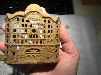 A.C. Williams child's coin bank (cast iron, c. late 1800s/early 1900s).