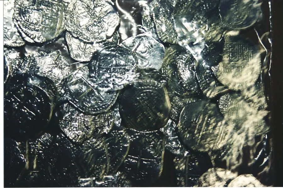 A whole bunch of coins from a clump in a treasure chest that were just out of the electrolysis and I was polishing in the tumbler.