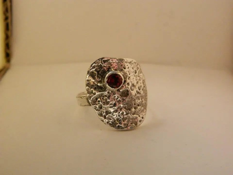 Abstract sterling silver and garnet ring
