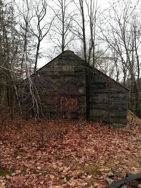 An old building along the river. Dated 1893. No luck here