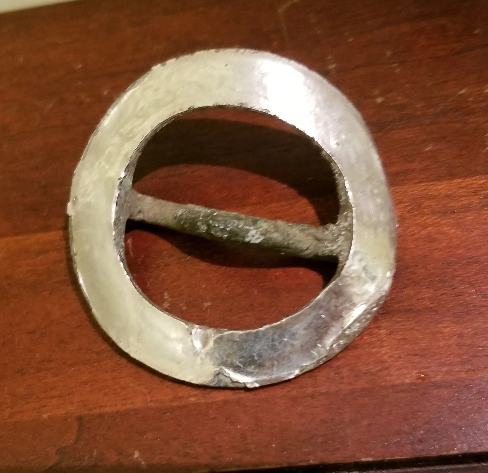 Applied silver annular buckle