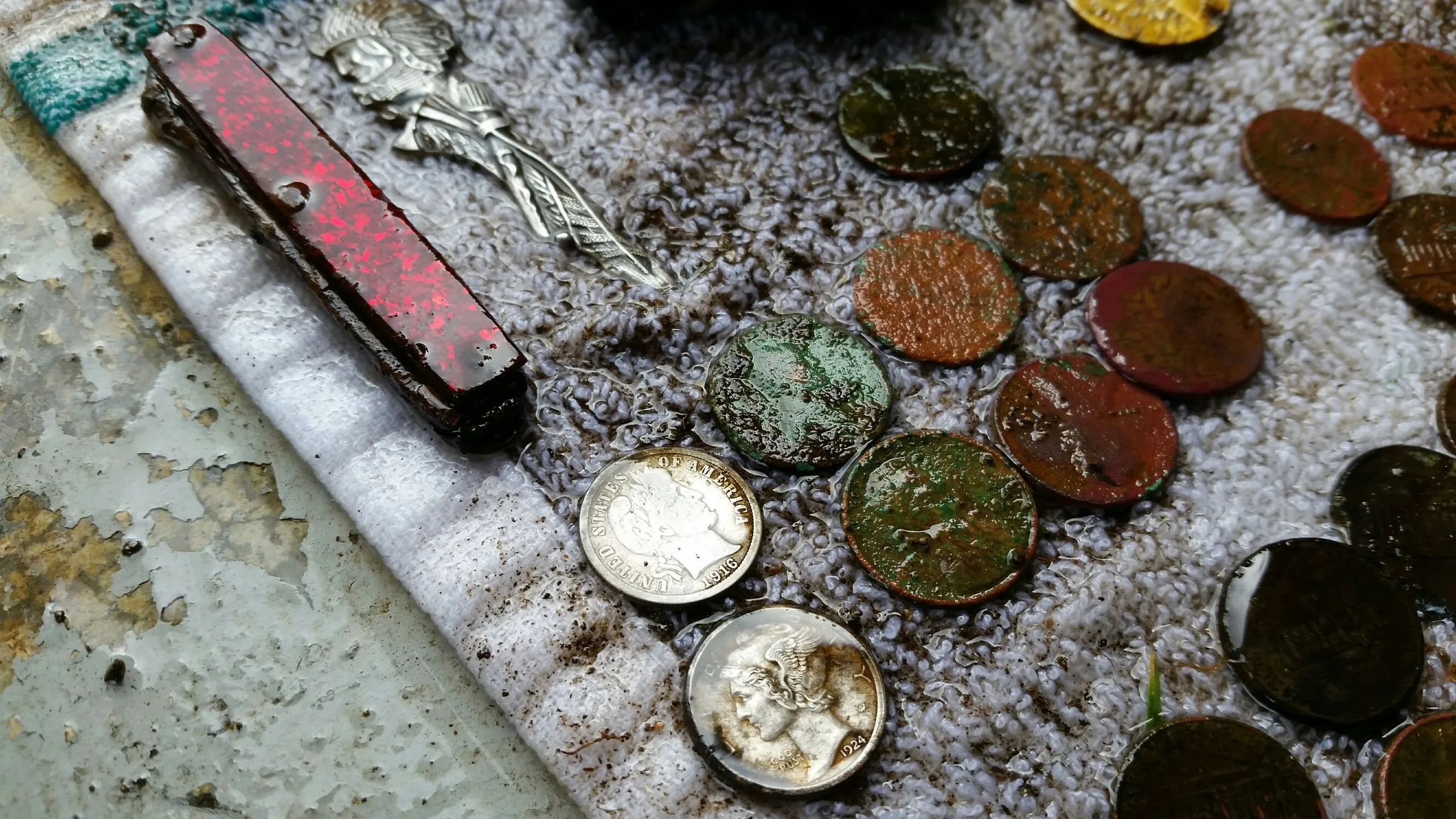 Barber Dime and assorted finds after a hunt.
