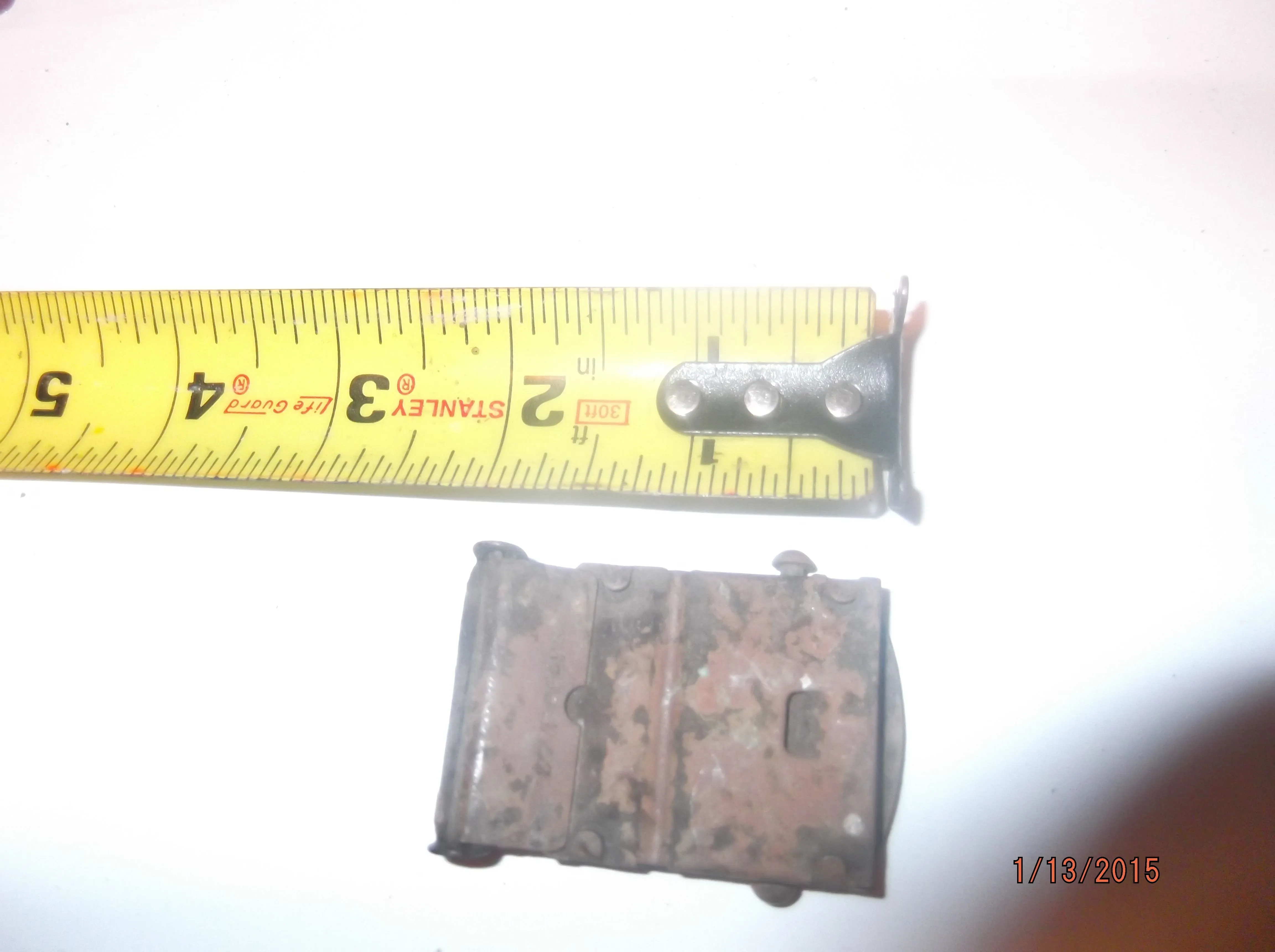 bottom side of belt buckle only markings "SOLID BRASS"