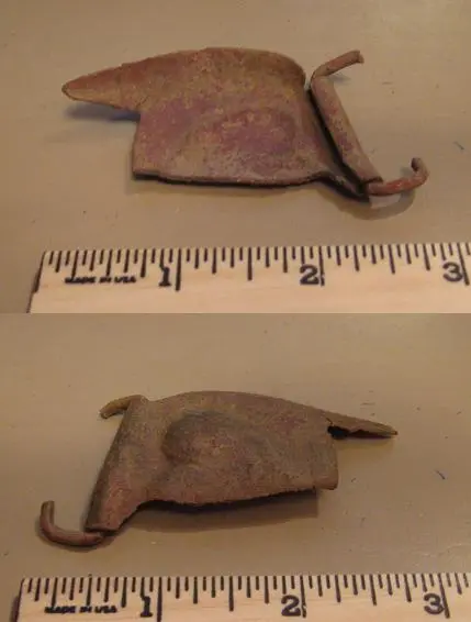 Brass heart buckle cover fragment - Found near an old barn site on the west side of the Kansas City metro area.  Summer 2009.