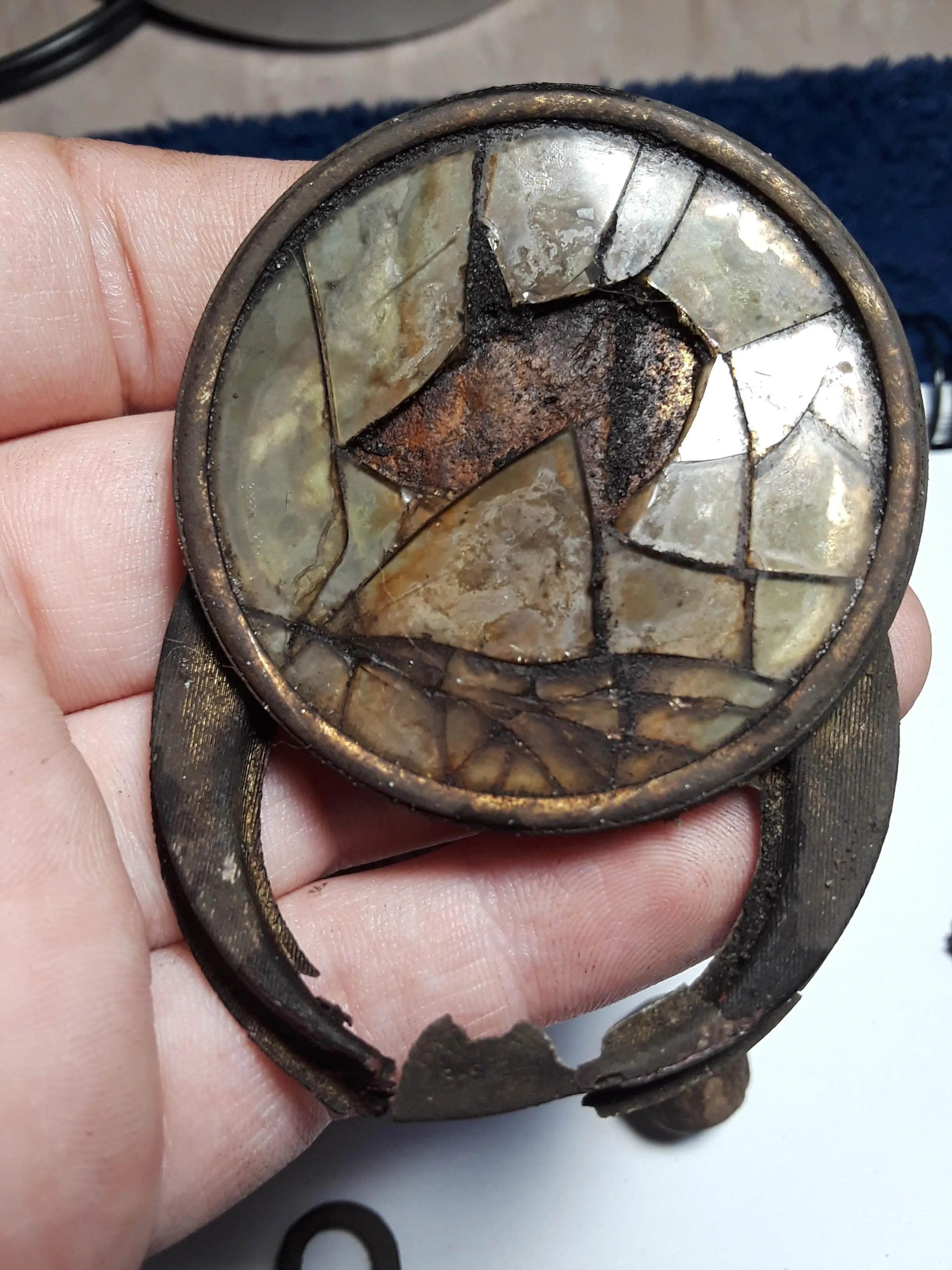 Compact Mirror - possibly mother of pearl glass
Says Patented 3-5-24
Found at a house built in 1930