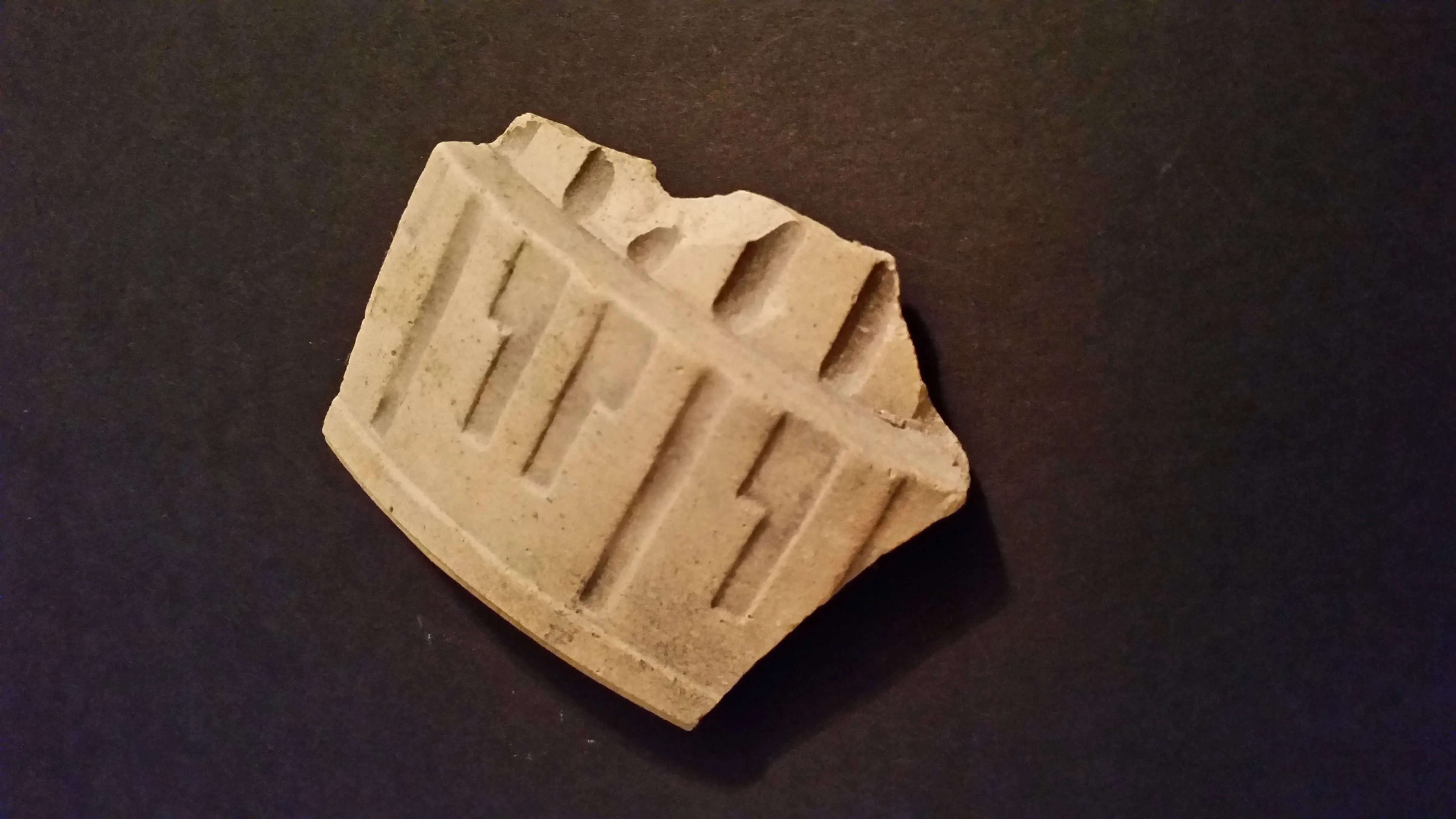 Creek find. Based on the size and thickness I think it is a top lip section of a mixing bowl.