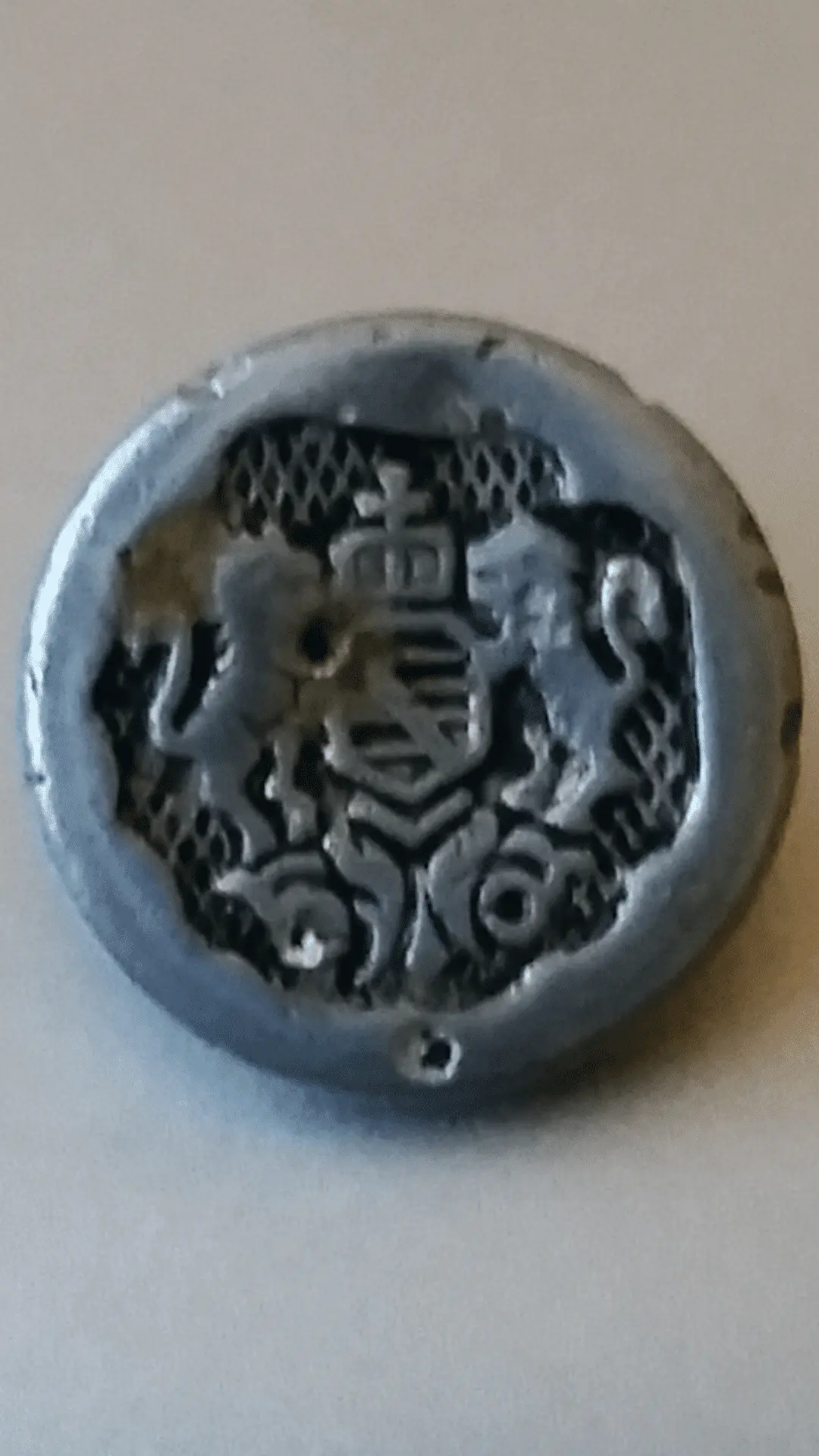 Dime size button