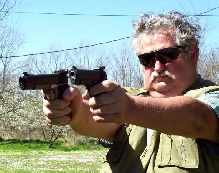 Double 45's - On my shooting range getting a little practice, just before my stroke.