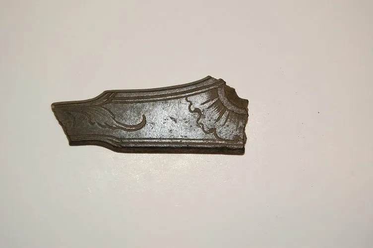 DSC 0011
Broken side plate from a musket or pistol. Copper alloy 1700's