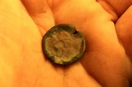 Eagle "I" Button 11-17-2010 - She is not the prettiest,but its a keeper Dug this in a cornfield,site of a former homestead