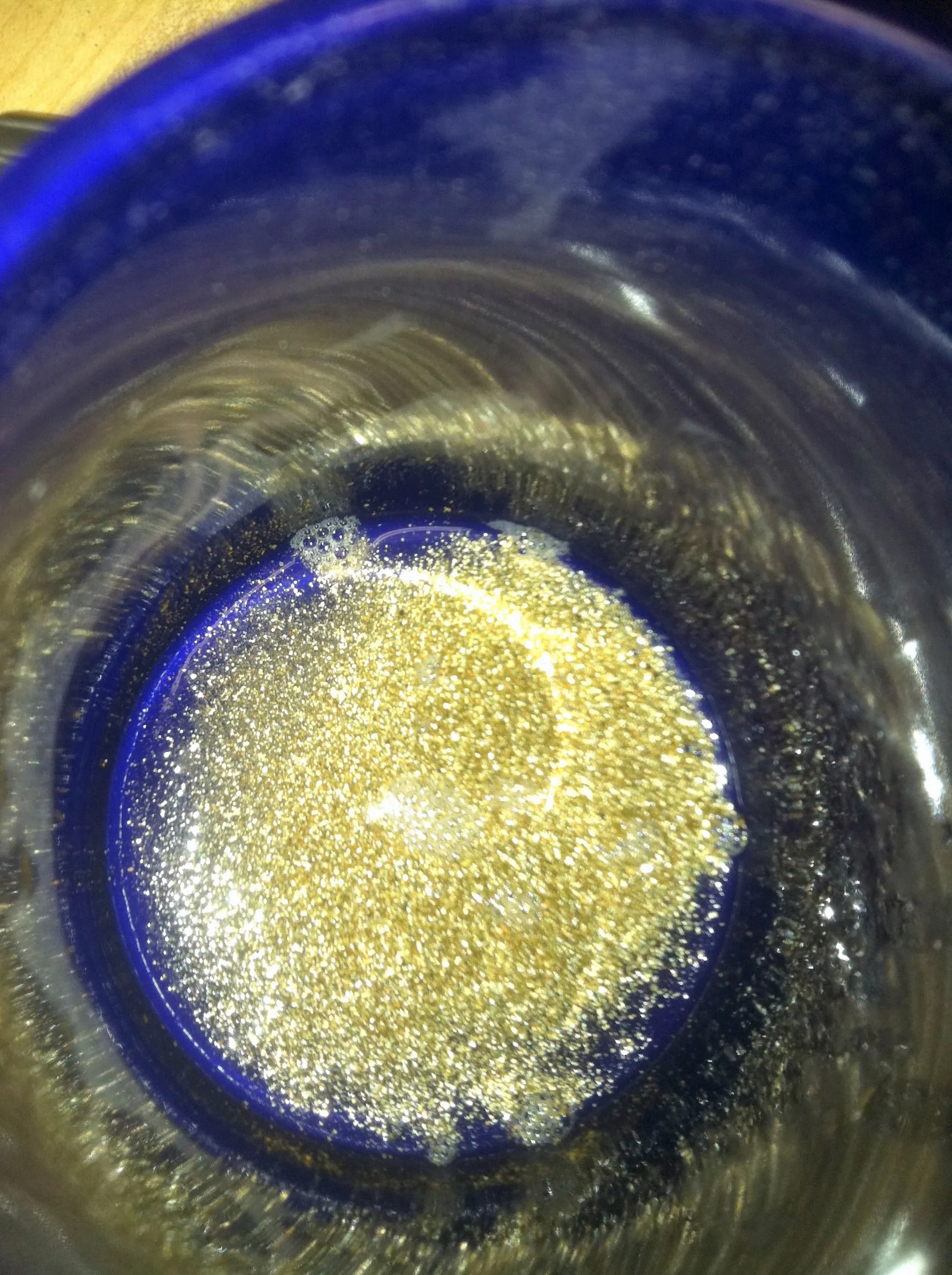 Float gold recovery viewing at the bottom of a purple coffee cup. www.portadrillmini.com Gold Driller  auger sampler