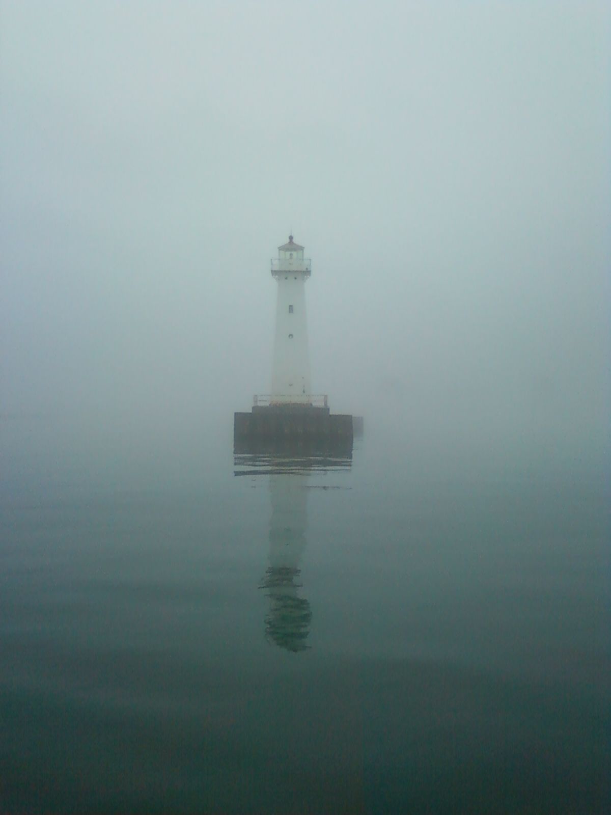 foggy pier, crytstal clear Lake Ontario. Sodus Point, NY