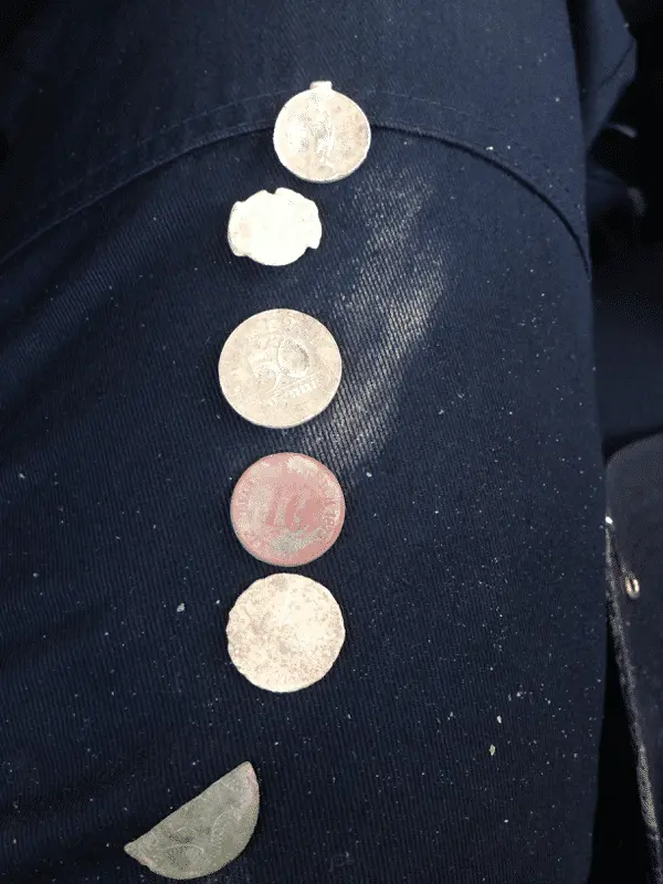 From top to bottom:

Cristian pendant
Old bag seal
50 pfennig
10 pfennig
10 pfennig
Half tom back button