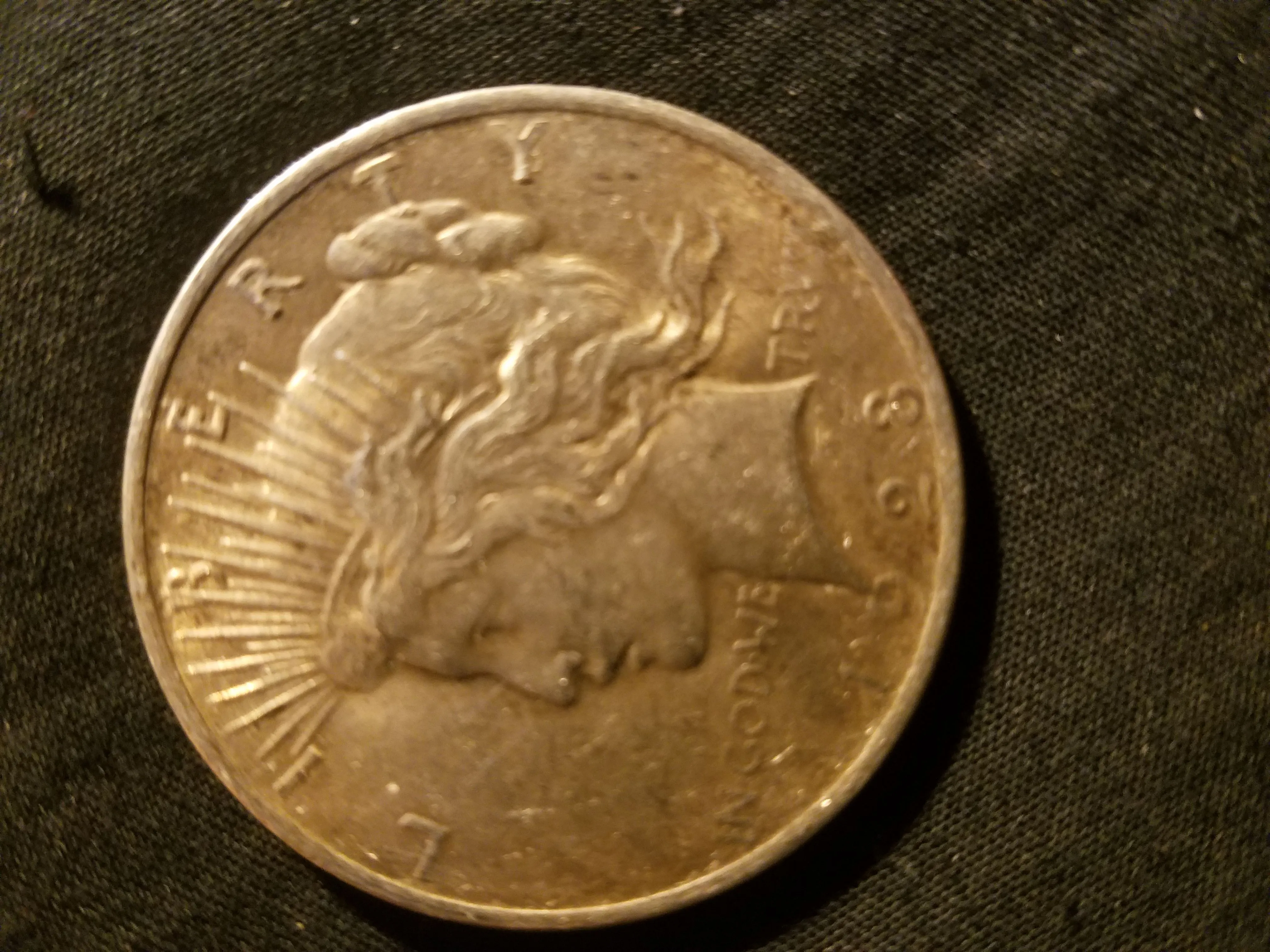 Guy in front of me paid for his coffee with this and I wasted no time buying it from the cashier....1928 Philadelphia key date peace dollar
