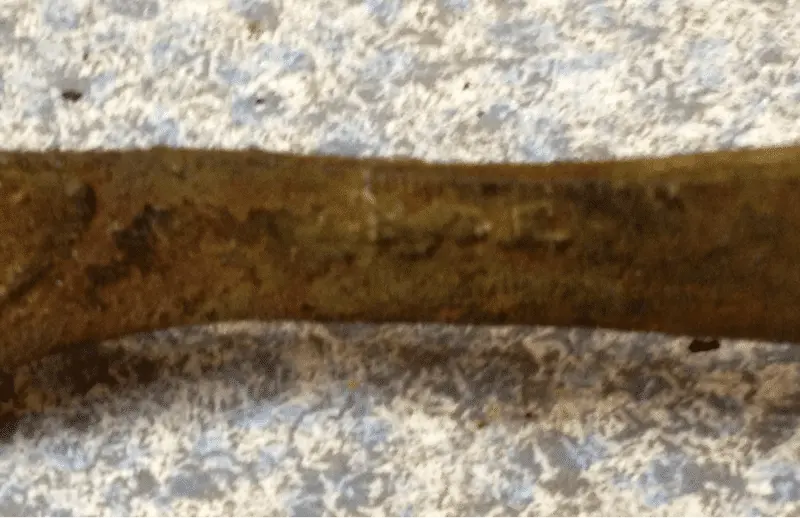 I can't make out the mark. Down time research. Dig first...research later.