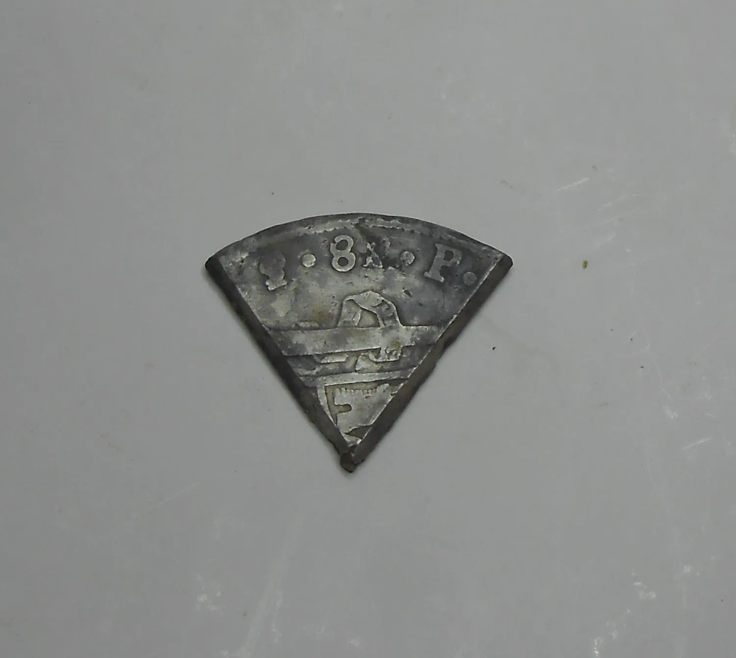 I was hunting with Doug & Tenn. Digger in middle Tenn. on 1-28-15 as we searched for old homes. I dug the 60 deg. piece of an eight Reales Spanish coi