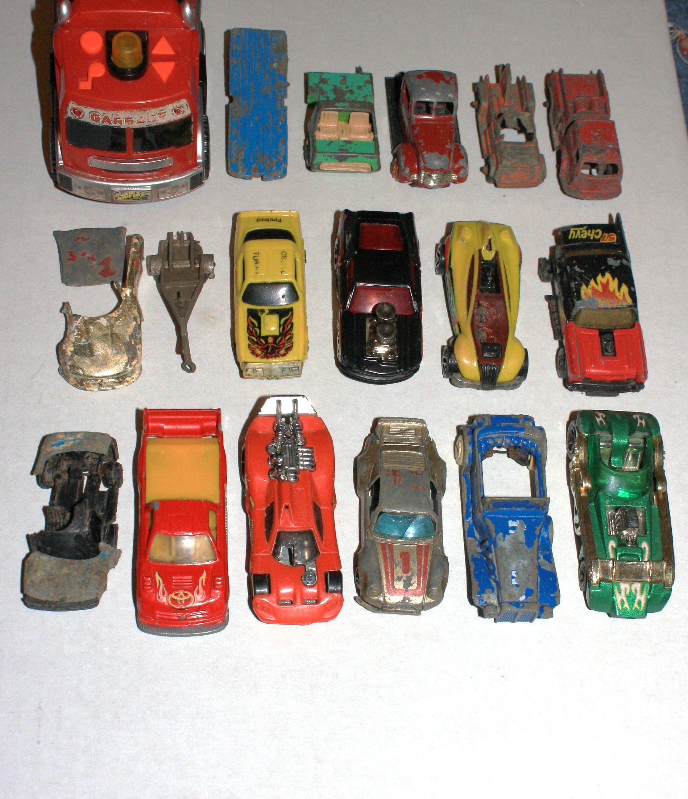 IMG 2234 The toy car junkyard lol.  The two trucks in the back row upper right, a tow truck and a pumper are both Tootsie Toys of Chicago.  They also 