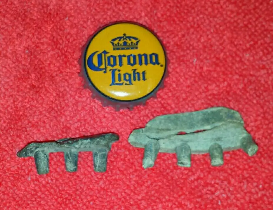 Lead from a round ball mold after the round balls were cut off.  The Corona cap is for size reference :)