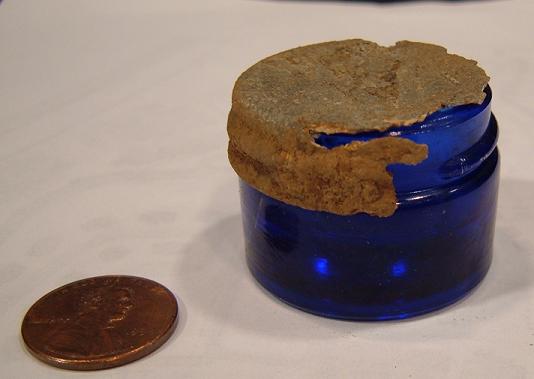 Little Blue Jar - The penny is for size comparison. Found this little jar while hunting a old home site.