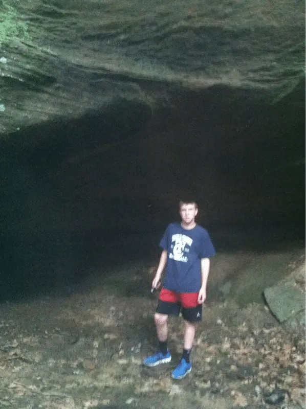 Little brother about to explore one of the larger caverns we found