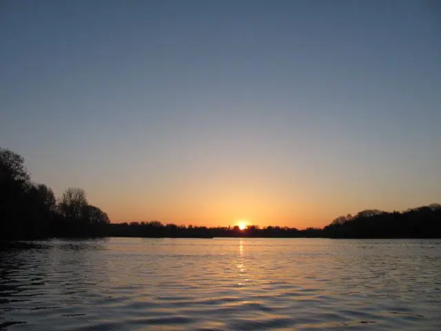 May 2012, Sunrise atop the Huron township trees. Sodus, NY