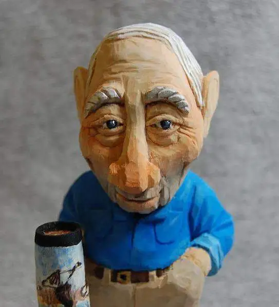 My Dad - A caricature carving I did of my dad.  He always drinks tea.  I had him holding his glass with a few dribbles on the base.  I called it the "