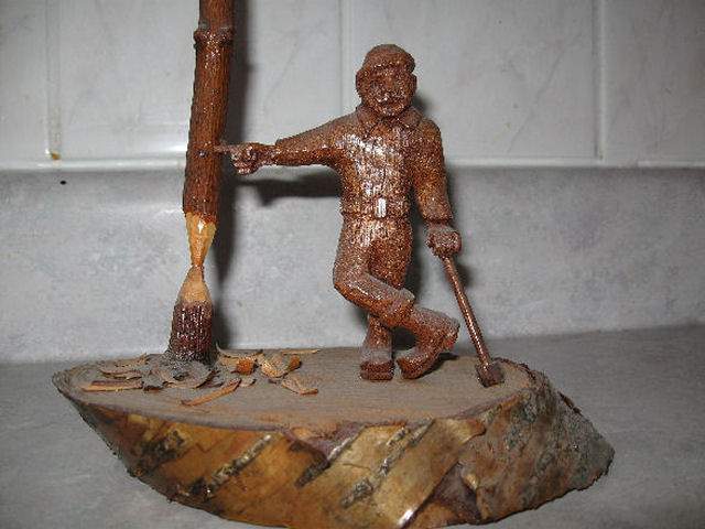 My little Lumberjack - I carved the man from a piece of mahogany, his axe from Brazillian
Rosewood. Made sometime back in the 70's.