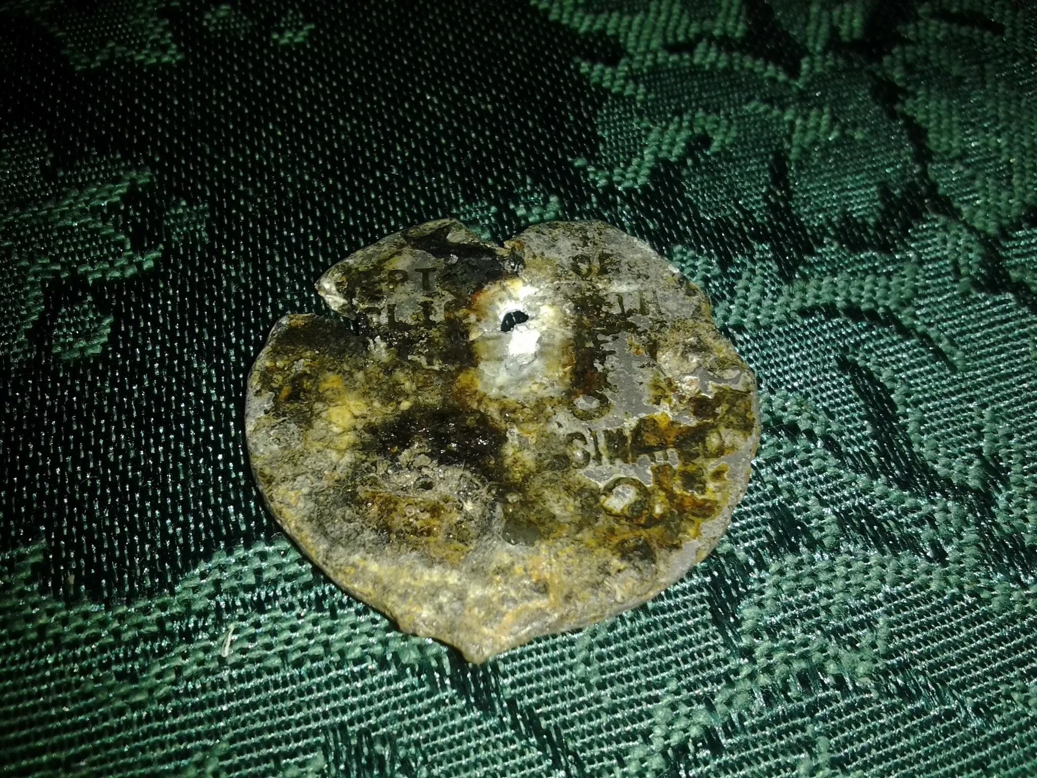 Not sure what this is??? Maybe an old police pin/badge?? Kind of hard to see but the top left has... CPT-------of. then the next line has olice---. th