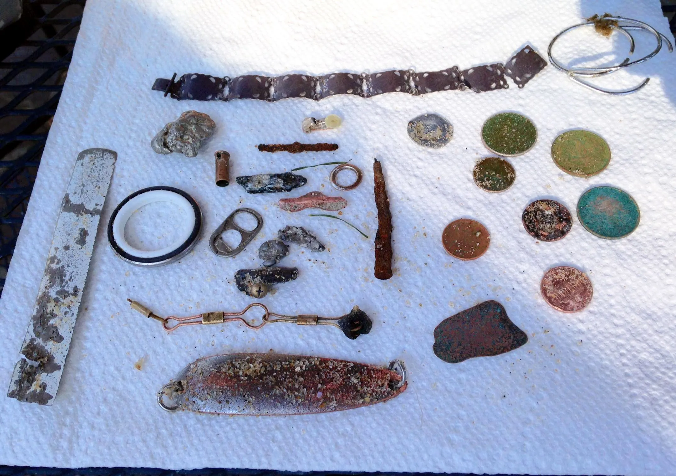 Oct 18 13 PP
Everything here was found on a  salt water beach in central NJ on a (hard packed sand) "coin line” all app 15" to 20" deep. The coins fou