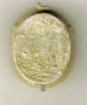 old silver locket that has a lock of hair in it