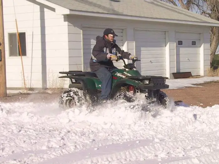 Our son plowing through - The ATV has become the general purpose workhorse on a farm or ranch nowadays.  Replaced the horse or mule for the most part.