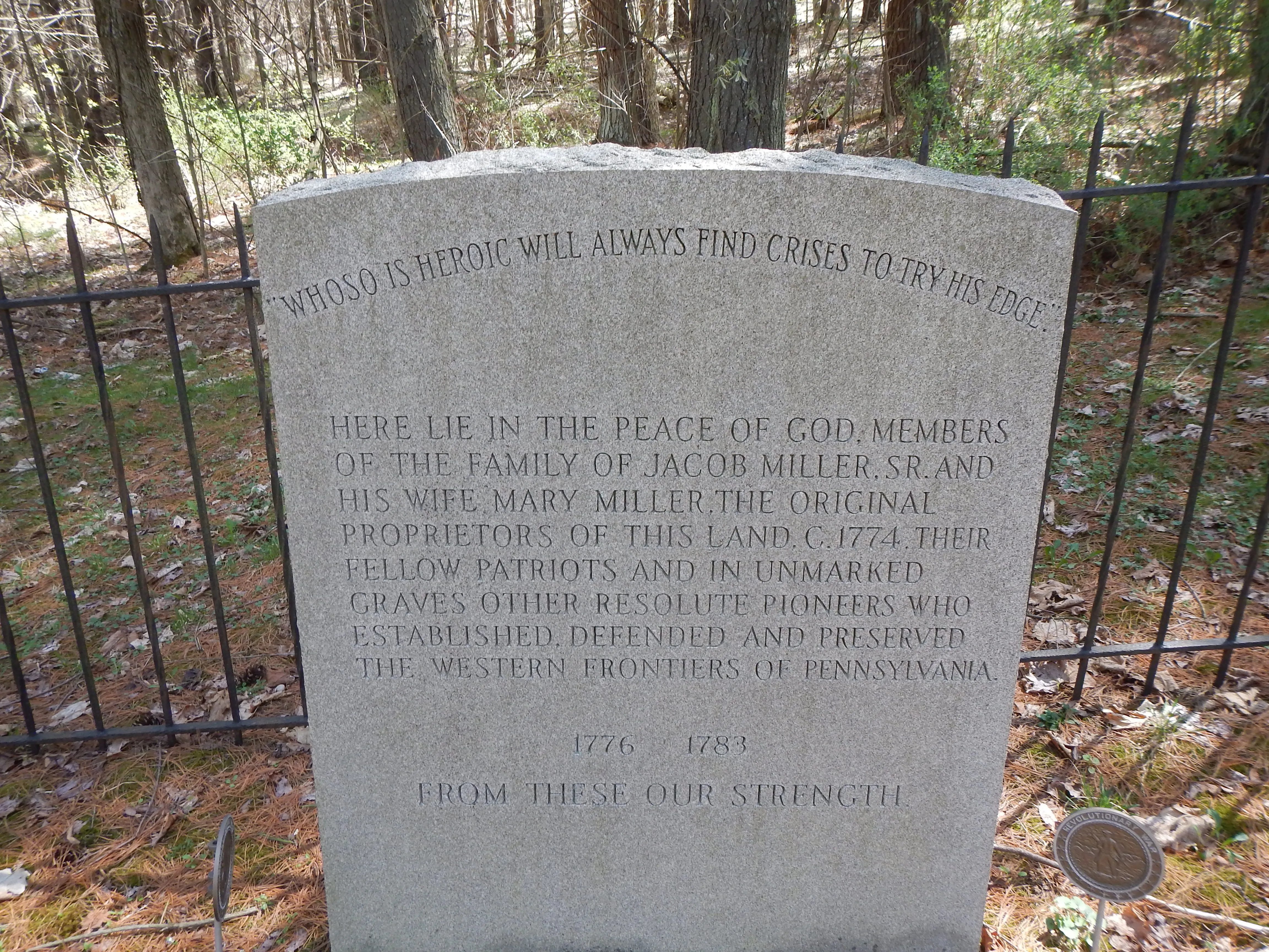 Plaque erected within cemetery by historical society.