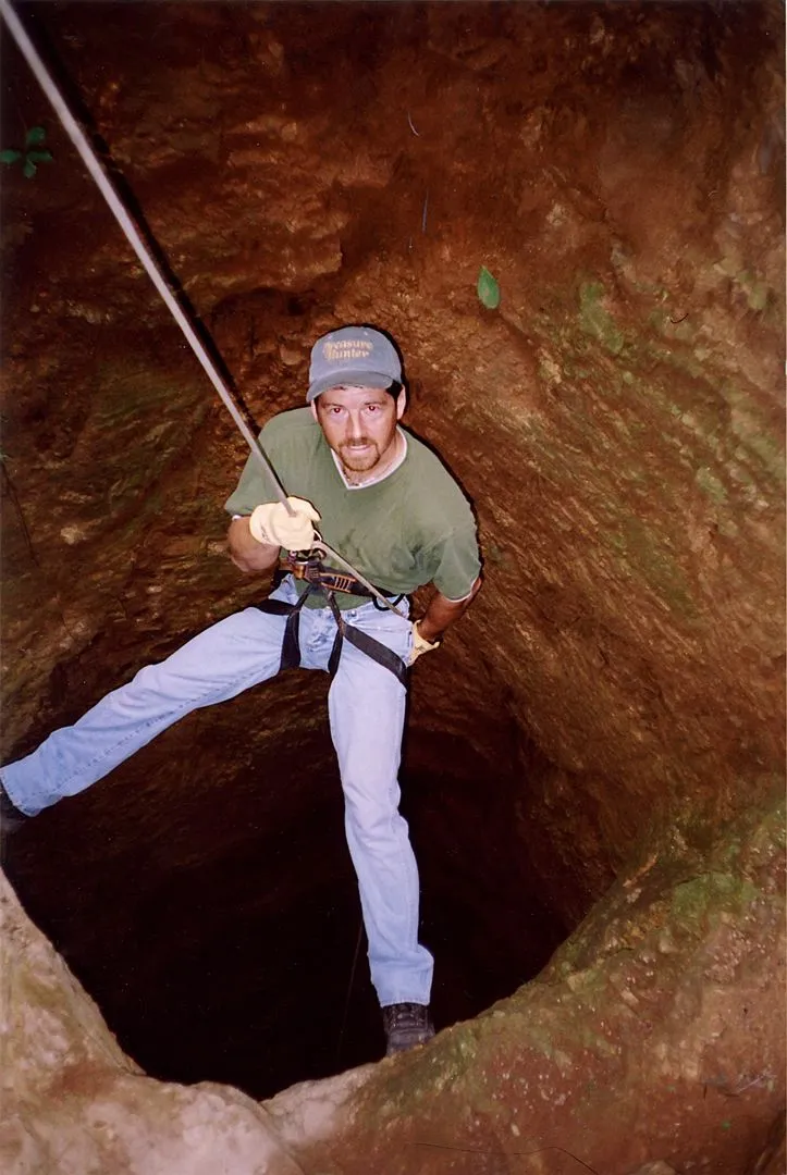 Rappelling into a silver mine.