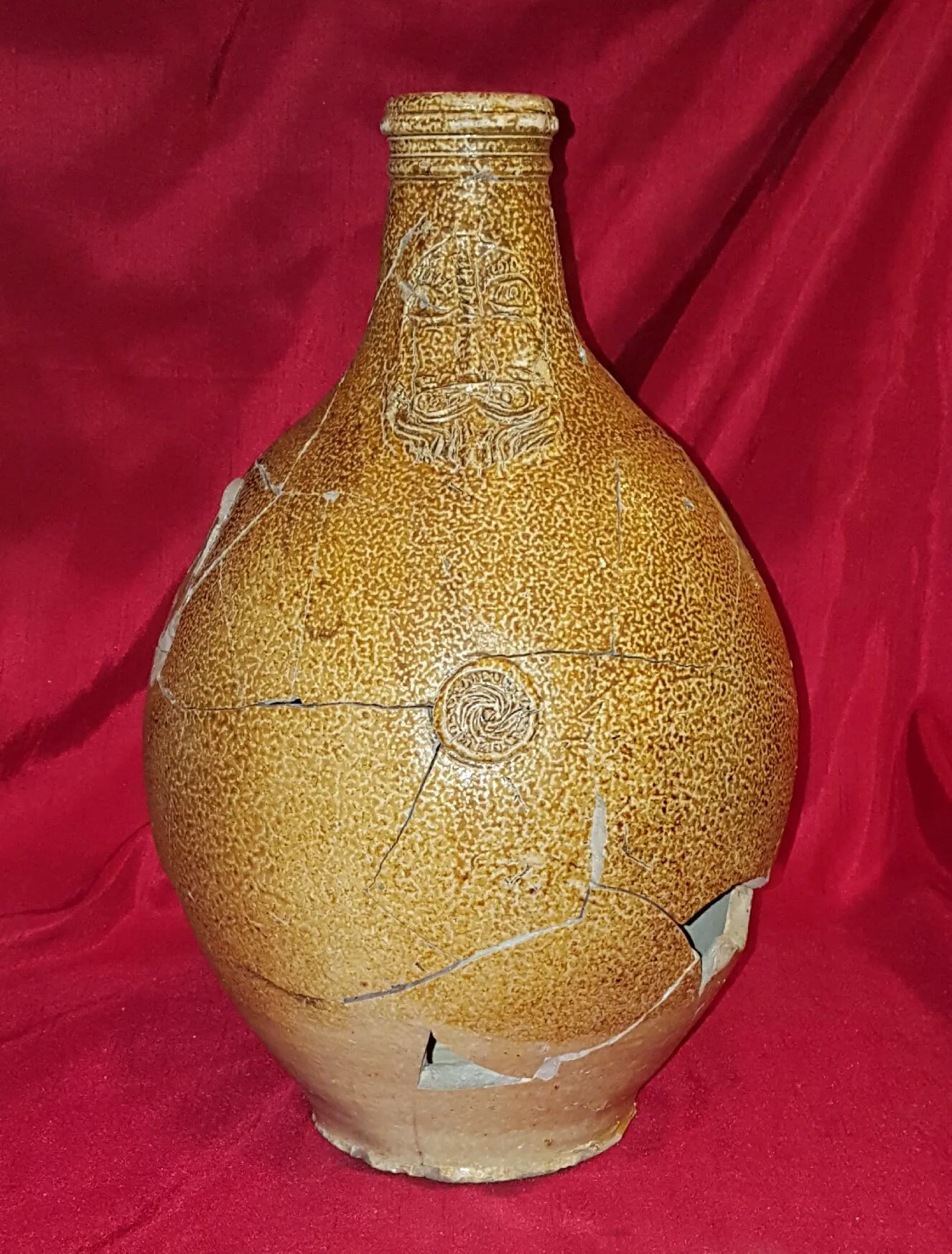 Reconstructed 17th century Bellarmine (aka Bartmann) jug. Shards dug from the "Swamp Pit"