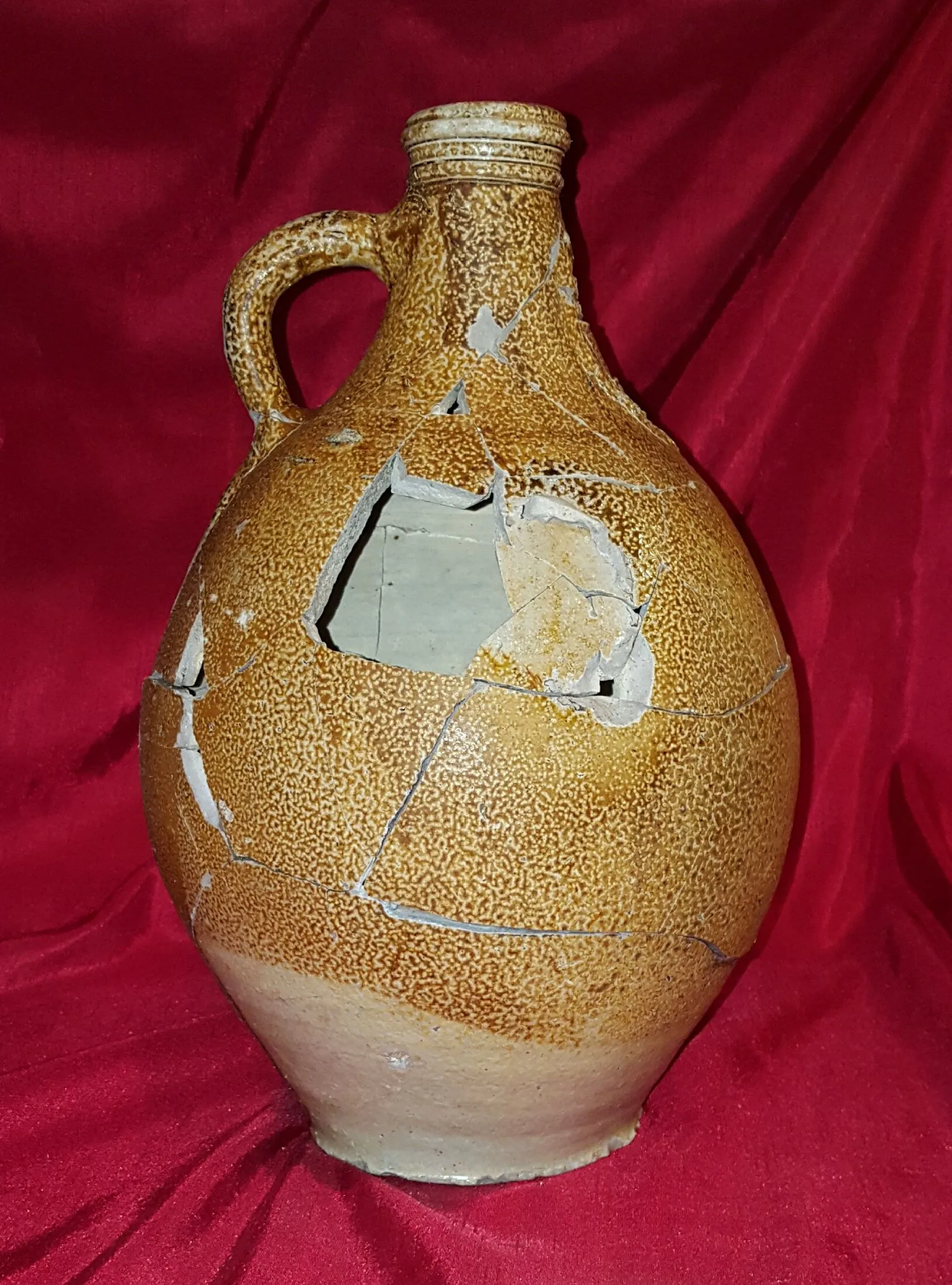 Reconstructed 17th century Bellarmine (aka Bartmann) jug. Shards dug from the "Swamp Pit"