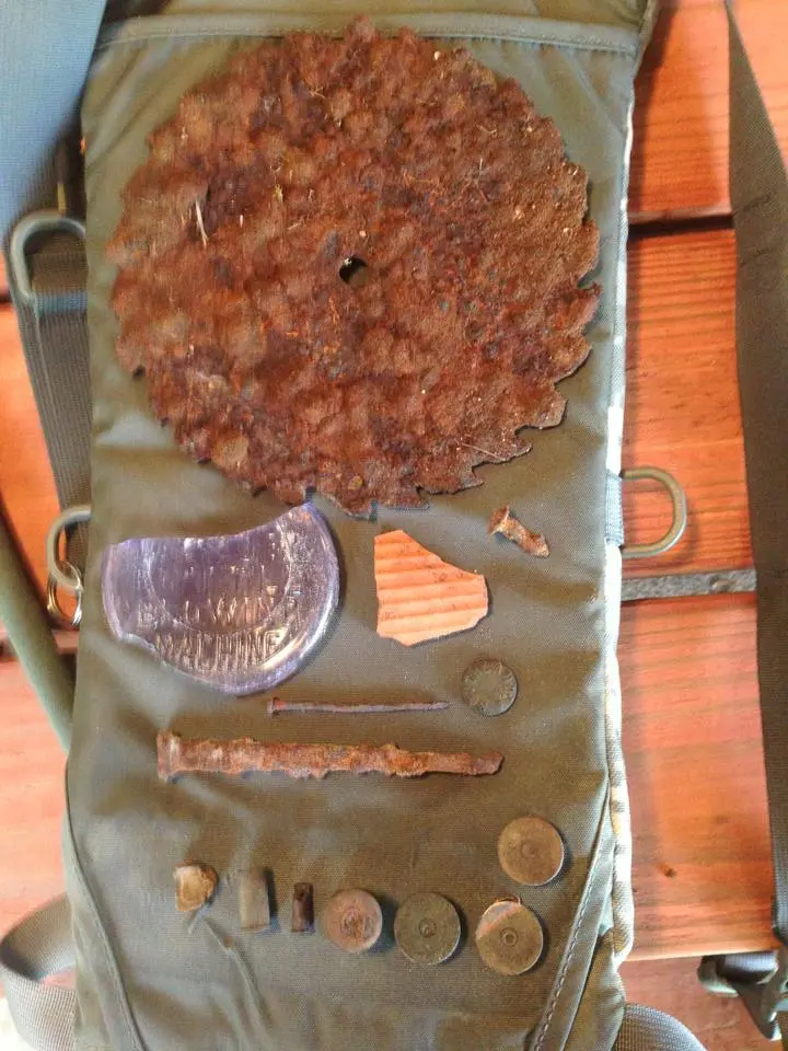 Saw blade, pre electrolysis, shotgun ends, pottery shards, etc